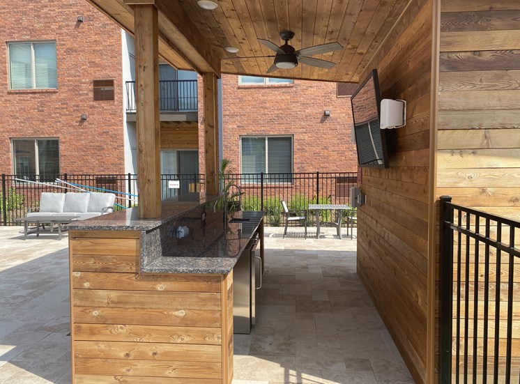Outdoor bar area with large screen TV
